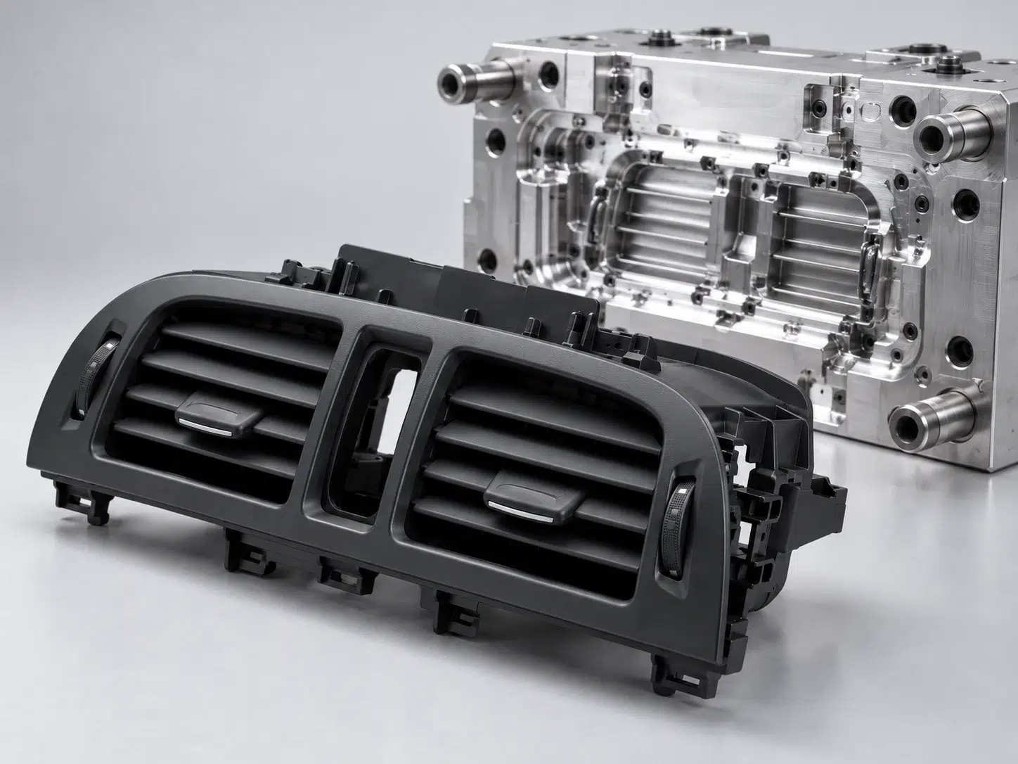 Automotive air vent injection molded part with precision injection mold tooling